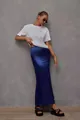 Detailed view of an elegant navy blue satin fishtail midi skirt worn by a model - Navy Blue