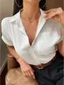 Elegant white satin short sleeve V-neck shirt for women in a classic button-down style - XS / Tops / White