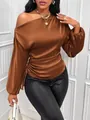 Detail view of a brown satin blouse with asymmetrical slanted neckline and long sleeves. - S / Tops / Coffee