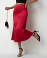 Detailed view of red satin fishtail midi skirt showing elegant fabric drape - S / Bottoms / Red
