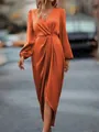 Elegant orange satin maxi dress with lantern sleeves, V-neck, and twisted waist detail - Orange