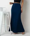 Detail view showing the elegant drape and texture of the navy blue satin maxi skirt. - Navy Blue