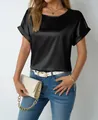 Detail view of a black satin short-sleeved blouse with elegant silky texture and rolled cuffs - S / Tops / Black