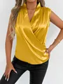 Close-up detail of golden yellow satin sleeveless blouse featuring elegant wrap V-neck design - Yellow