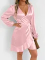Detailed close-up of a elegant pink satin wrap dress featuring long sleeves and ruffled hem. - Pink