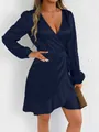 Close-up of a navy blue long-sleeved satin wrap dress with elegant ruffled hem details - Navy Blue