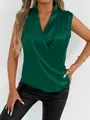 A detailed look at the elegant emerald green satin fabric and sophisticated draping - Green