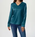 Close-up of elegant teal satin long-sleeved shirt with a stylish V-neck design - Malachite green