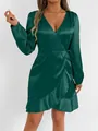 Detailed view of an emerald green satin long sleeve wrap dress featuring elegant ruffle hem - XS / Top And Bottom / Dark Green