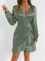 Detail of sage green satin long sleeve wrap dress with ruffle hem and V-neckline. - Light Green