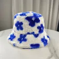 Detailed view of a soft plush bucket hat with vibrant blue floral pattern on white - M (56-58cm) / Blue