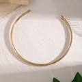 Detailed view of a minimalist smooth gold neck ring choker with a high-polished finish - Gold (06036)