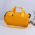 Vibrant yellow cylindrical fitness gym bag with durable handles and shoulder strap - S / Turmeric