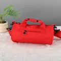 Compact red cylindrical sports gym bag with dual handles and adjustable shoulder strap - S / Red