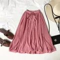 Elegante blusa de gasa plisada en rosa palo con cuello lazada y manga larga para mujer. - Talla única / Tops / Rosa
