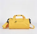Bright yellow cylindrical gym bag with adjustable shoulder strap and top handles - Sunflower Yellow