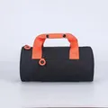 Cylindrical sports gym bag in black with vibrant orange handles and zipper pulls - Black & Sun Orange