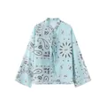 Detail view of light blue paisley print long sleeve blouse with lace-up neckline - S / Tops / Light Lake Blue