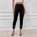 Zwarte stretch skinny broek met hoge taille en elegante bloemen kanten details onderaan - M / Bottoms / Zwart