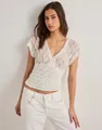 Detail view of white floral lace V-neck mesh top for women with Y2K style - S / Tops / White