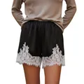 Elegant black satin shorts with white floral lace trim and wide-leg design - Black