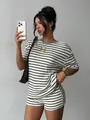 Chic model wearing a black and white striped short sleeve t-shirt and shorts casual set - S / Top And Bottom / White