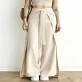 Elegante beige weit geschnittene Hose mit hoher Taille, Bindegürtel und Seitenschlitzen - Aprikose