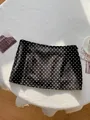 Macro detail of the sexy black and white polka dot print bodycon mini skirt for women. - S / Bottoms / Black