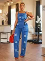 Close-up of stylish blue distressed denim overalls with ripped detailing and belted waist - S / Tops / Blue
