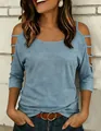Detail of a casual blue cold-shoulder t-shirt with stylish cutout sleeves for women. - Aqua