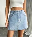 Detailed view of a stylish light blue denim mini skirt with asymmetrical hemline - XS / Bottoms / Blue