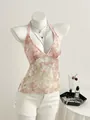 Macro detail of the intricate floral lace and shiny sequins on pink halter top - XS / Tops / Pink