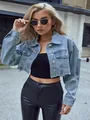 Stylish light blue cropped denim jacket with distressed details and raw hem design - 3XL / Tops / Blue