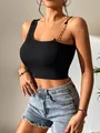 Close-up of black ribbed crop top featuring a chic metal chain shoulder strap detail - S / Tops / Black
