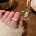 Elegant gold-tone bow open ring featuring heart-shaped pearls and a small zircon detail - Bowknot Style (J896 Gold) / Gold