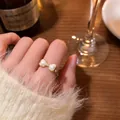 Elegant gold-tone bow open ring featuring heart-shaped pearls and a small zircon detail - Bowknot Style (J896 Gold) / Gold
