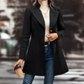 Elegant black mid-length lapel woolen coat for women shown in a stylish front view model. - S / Tops / Black