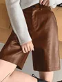 Detail of brown PU leather wide-leg shorts showing fine stitching and smooth premium texture. - S / Bottoms / Brown