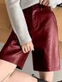 Detail shot of high-waisted wine red faux leather wide-leg shorts with a button closure - XL / Bottoms / Burgundy