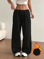 Détail du pantalon de jogging large pour femme en noir avec cordon de serrage à la taille - Noir