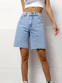 Detailed view of high-waisted light wash denim Bermuda shorts featuring raw frayed hem - XS / Bottoms / Blue