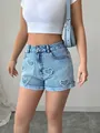 Pantaloncini di jeans a vita alta blu chiaro con motivi a cuore ritagliati sul davanti. - XL / Pantaloni e gonne / Blu