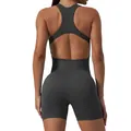 Back view of seamless one-piece yoga romper with cutout design and ribbed texture - Gun Grey