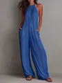 Detail view of blue pleated halter-neck jumpsuit with wide-leg design and pockets - S / Top And Bottom / Blue