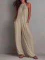 Detailed view of the pleated texture on a champagne halter neck wide-leg jumpsuit - Khaki