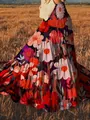Detail of vibrant bohemian floral print maxi skirt with artistic oil painting texture - S / Bottoms / Red