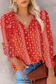 Close-up of red bohemian blouse featuring white geometric diamond patterns and V-neckline - S / Tops / Red