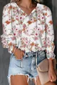 Detail of women's long sleeve floral print blouse with V-neck and drawstring design. - S / Tops / Cherry Blossom White