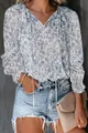 Detailed view of women's bohemian floral print blouse with V-neck tie and ruffled cuffs - Sky Blue