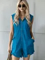 Detail view of blue sleeveless hooded romper with front zipper and ruffled hem details - S / Blue